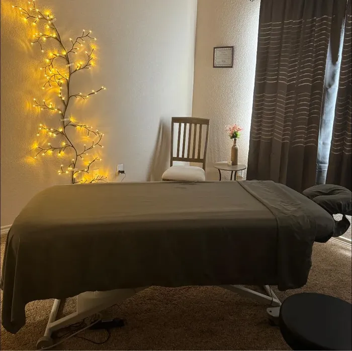Massage table under warm lights