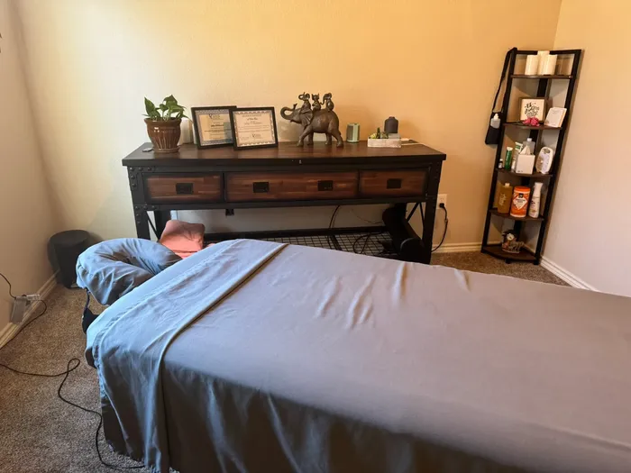 Massage table beside a dresser